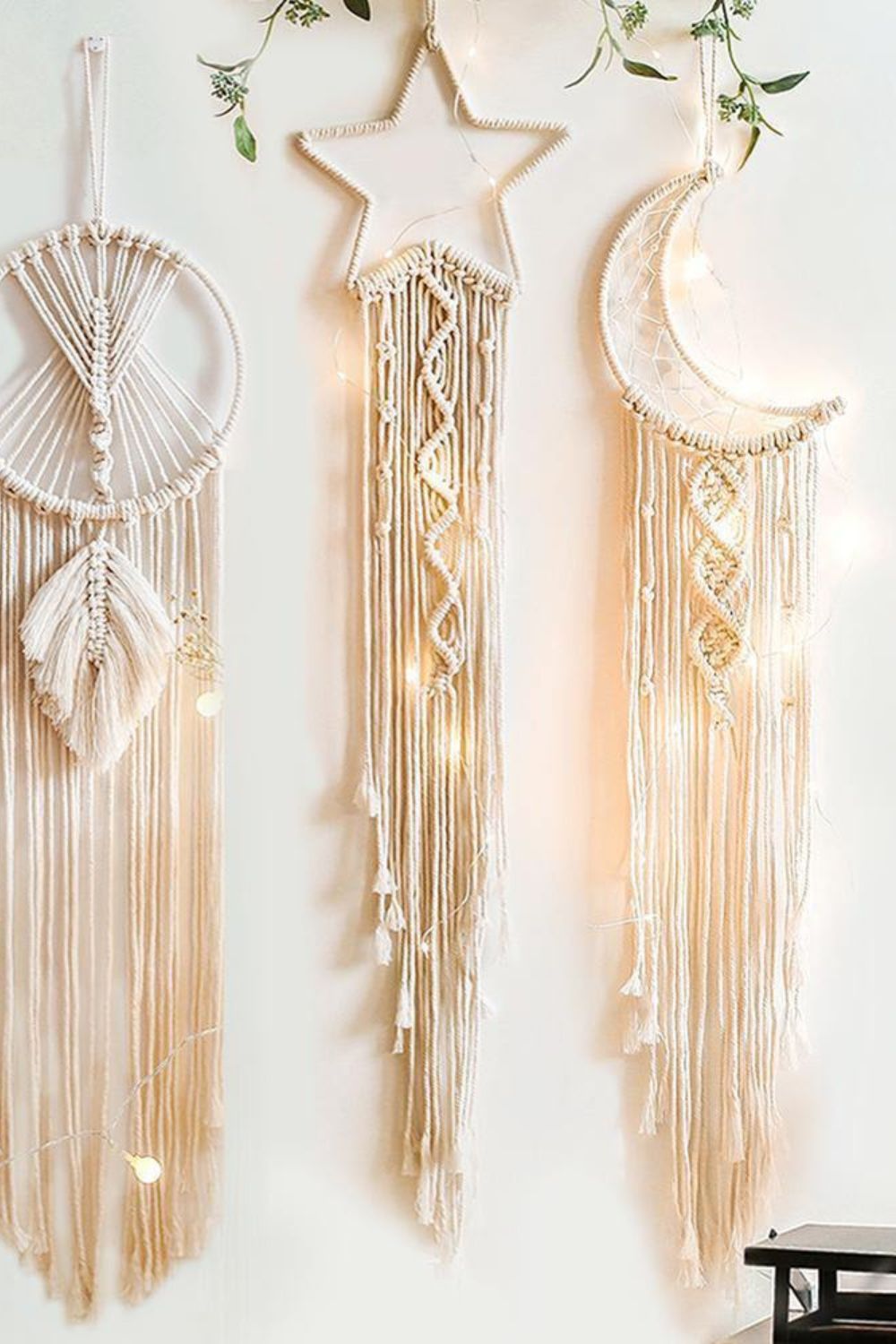 close up of moon and star macrame wall hangings