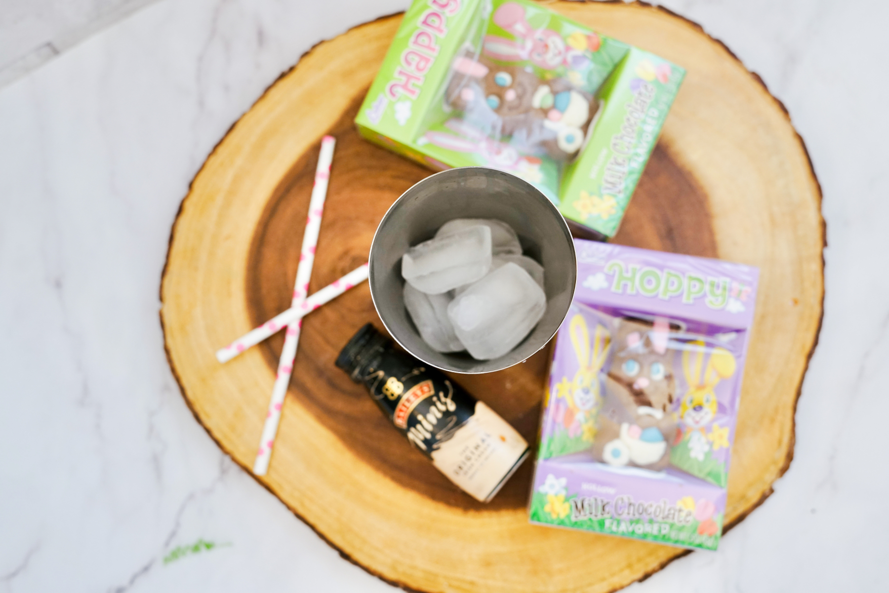 add ice to a shaker to mix the easter bunny cocktail