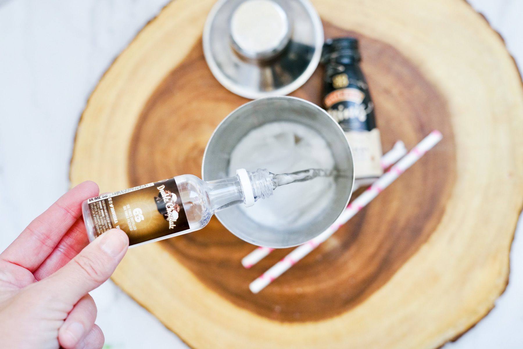 pour chocolate vodka to the shaker