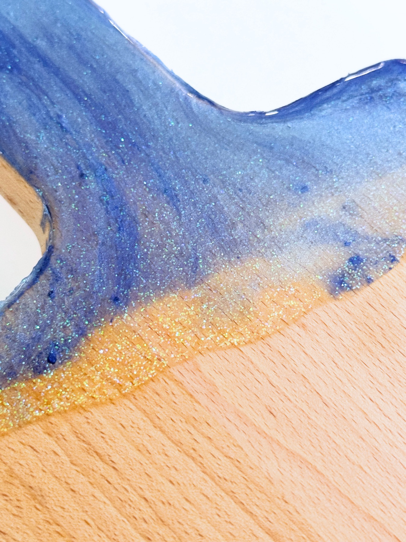 close up of finished resin cutting board web