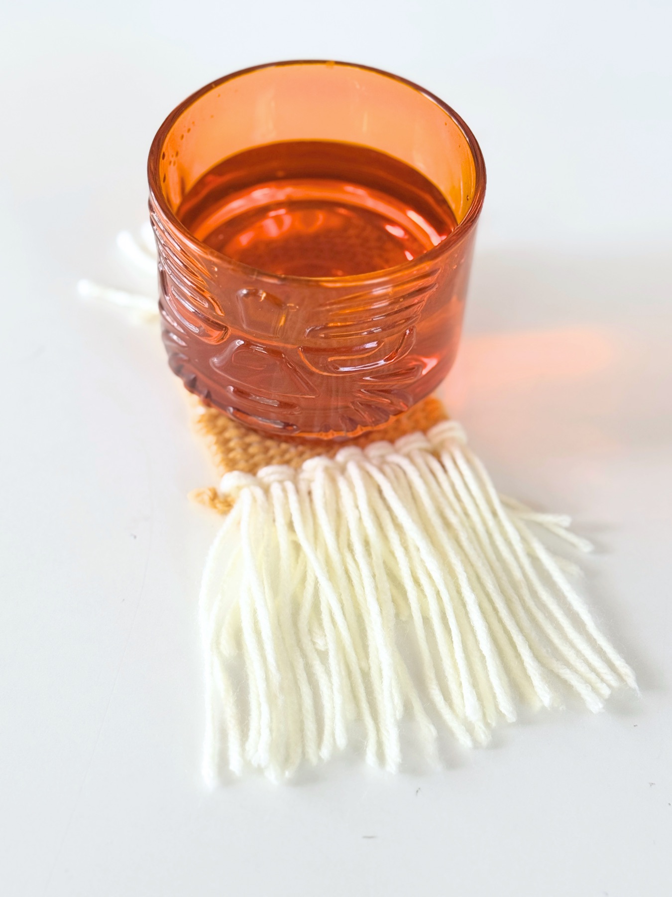 finished woven coaster with fringe web