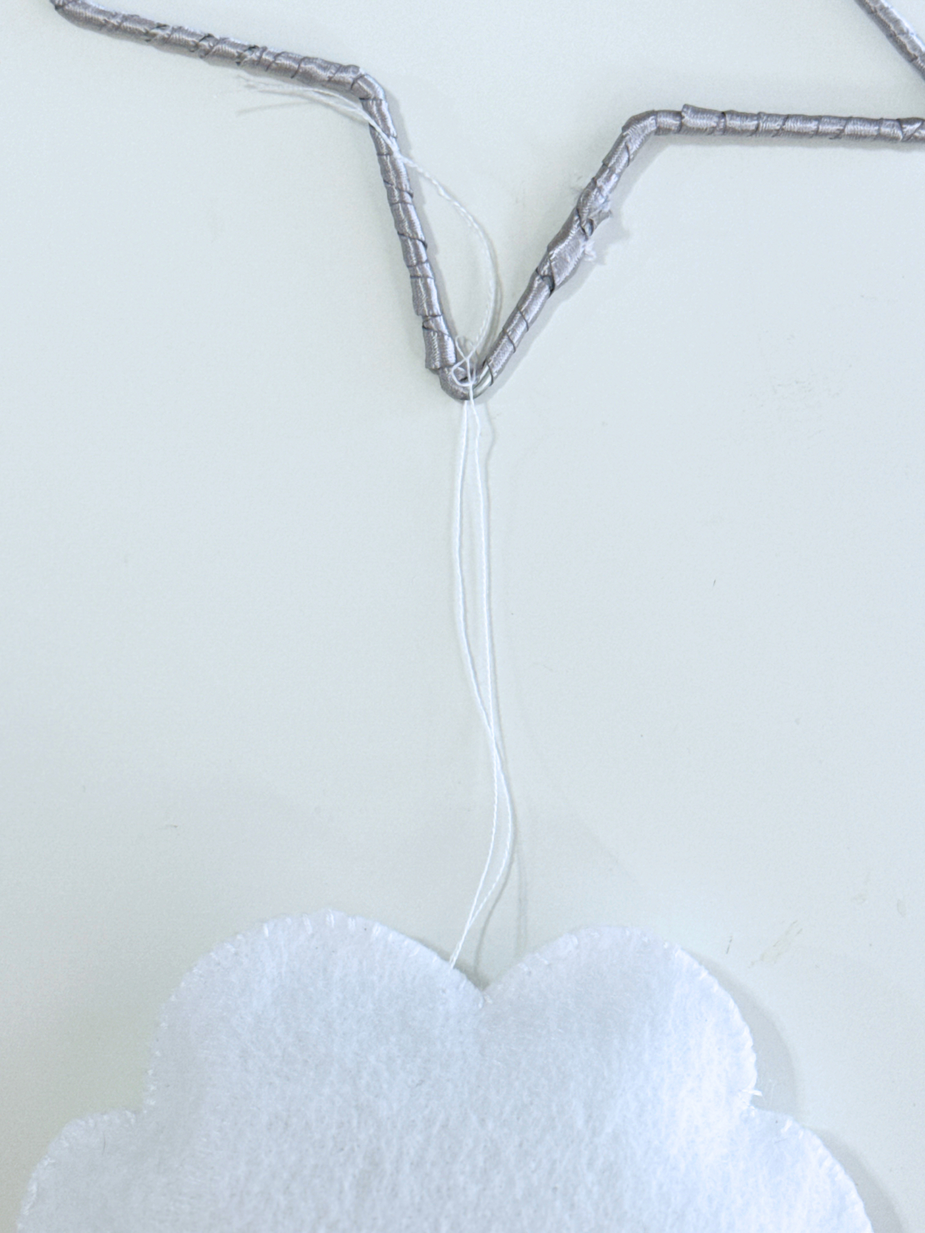 tie the thread to the metal star web