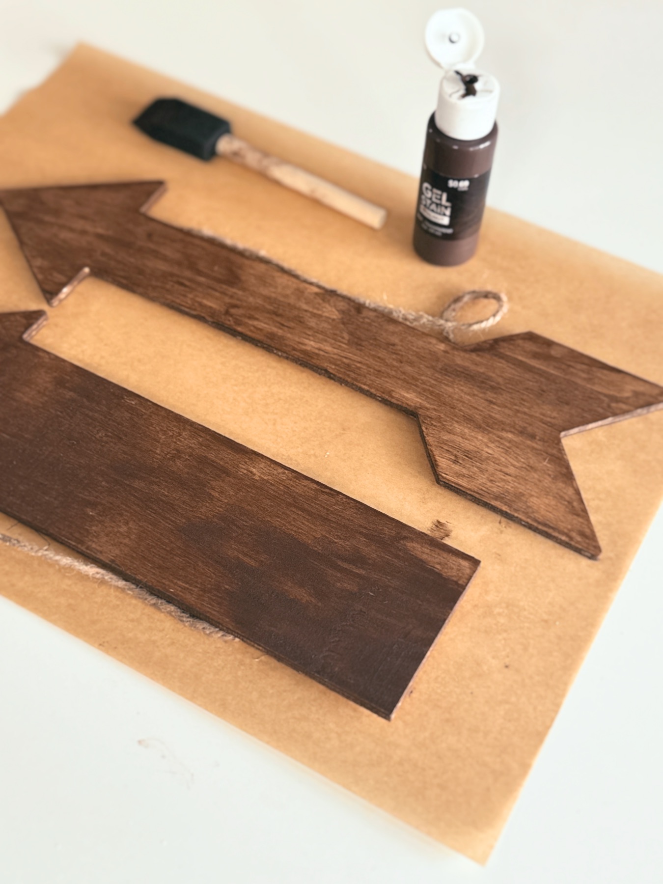 wood stained arrows ready to brush letter